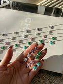 Conjunto Trevos com Zircônia Cristal e Lilás em Prata 925 Banho de Ródio Branco